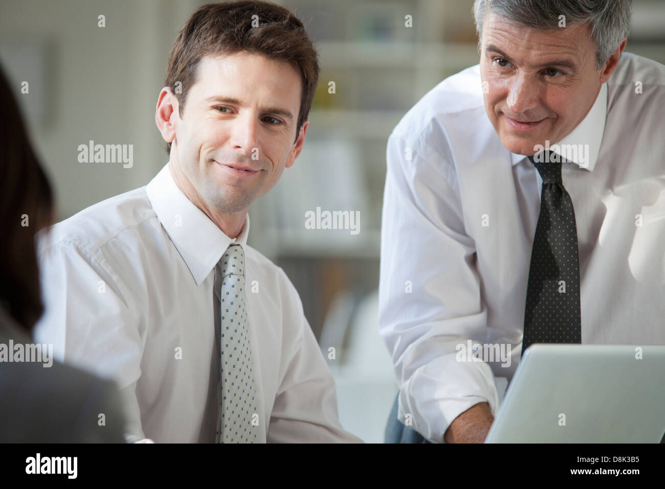 Business associates collaborating Stock Photo