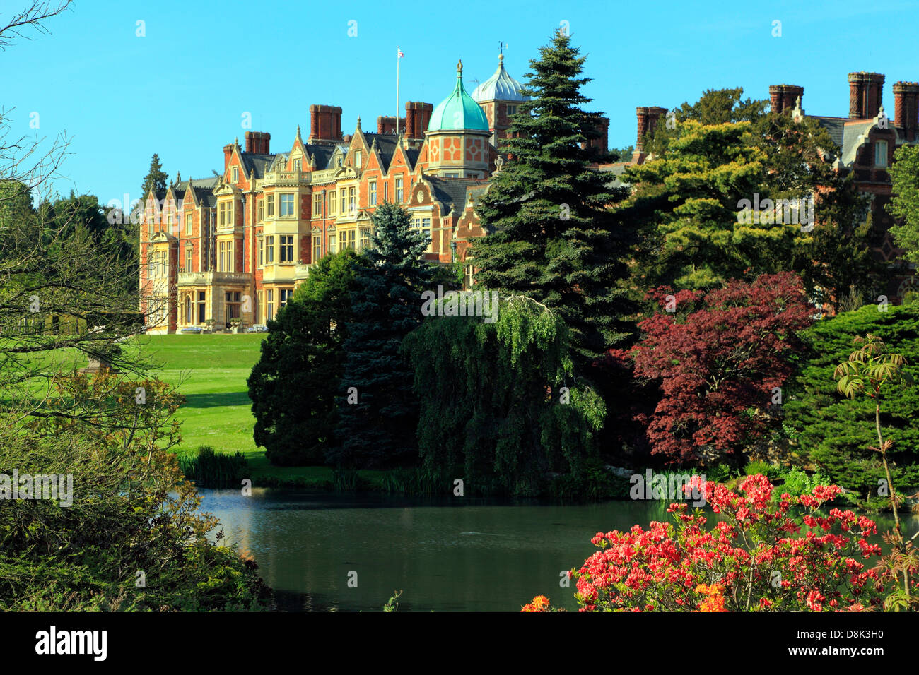 Sandringham House and Lake, Norfolk, country retreat of HM the Queen, 19th century British Victorian architecture, England UK Stock Photo