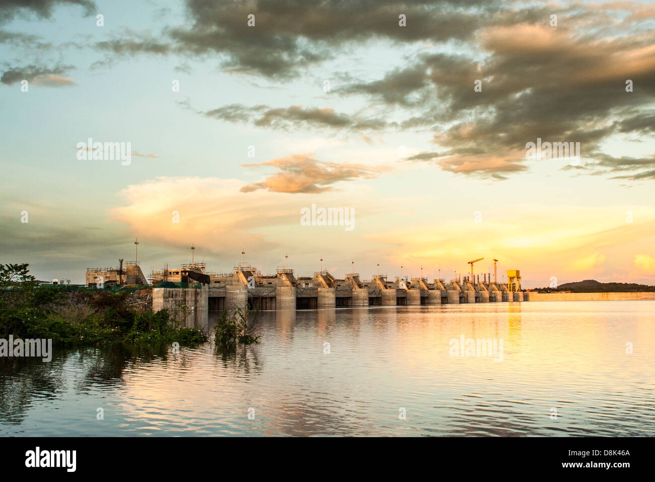 Sunset at the reservoir lake of Estreito Hydroelectric power plant dam spanning Tocantins River, in northeastern Brazil. Stock Photo