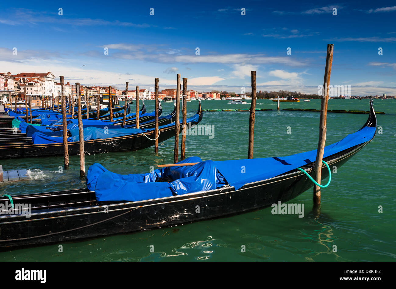 Gondolas on the dock of Piazza San Marco, Venice international landmark of Italy. Stock Photo