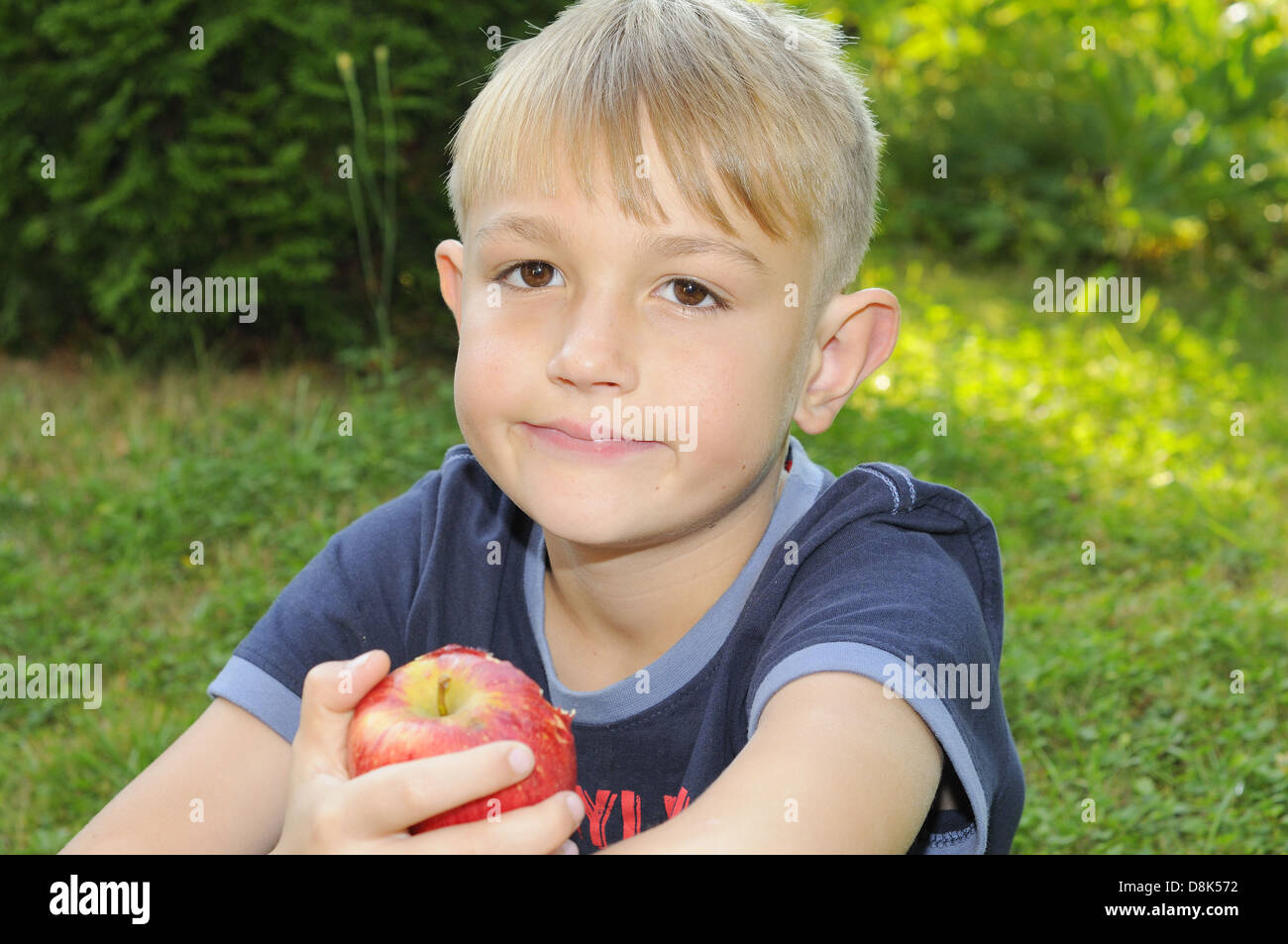 Boy with apple Stock Photo