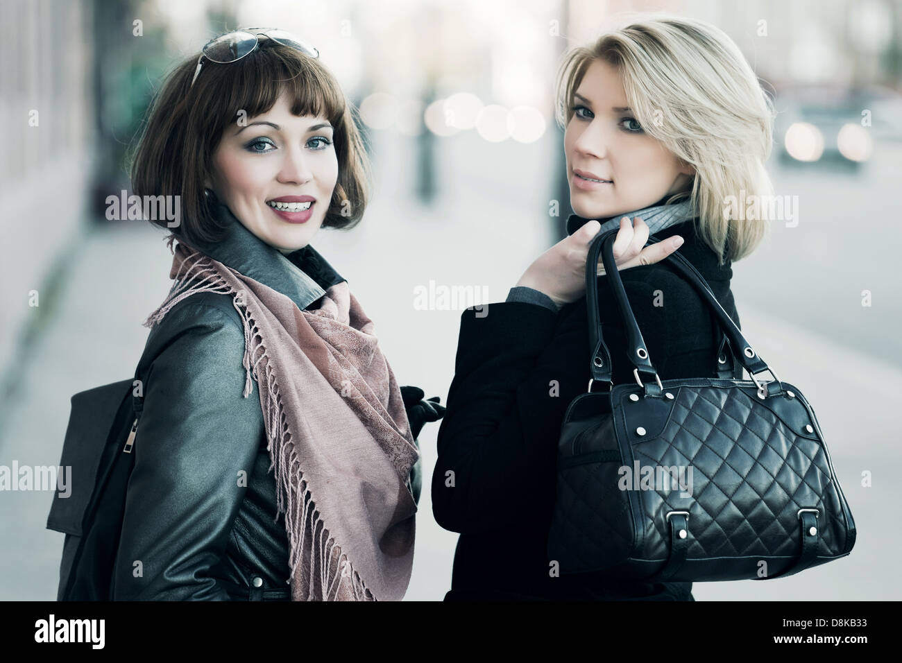 Two young women on the city street Stock Photo - Alamy