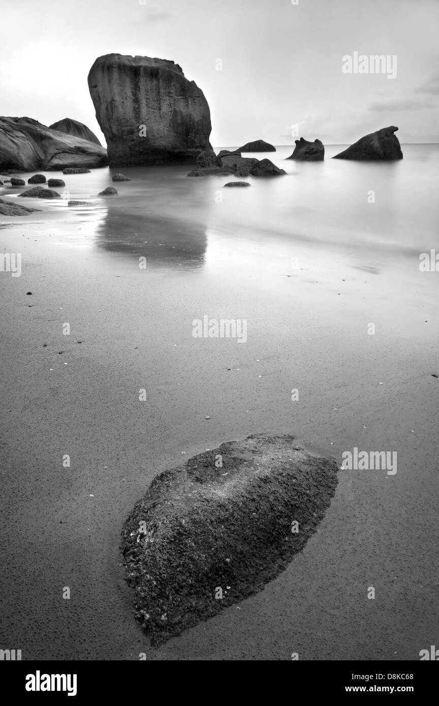 long exposure of rocks at beach Stock Photo