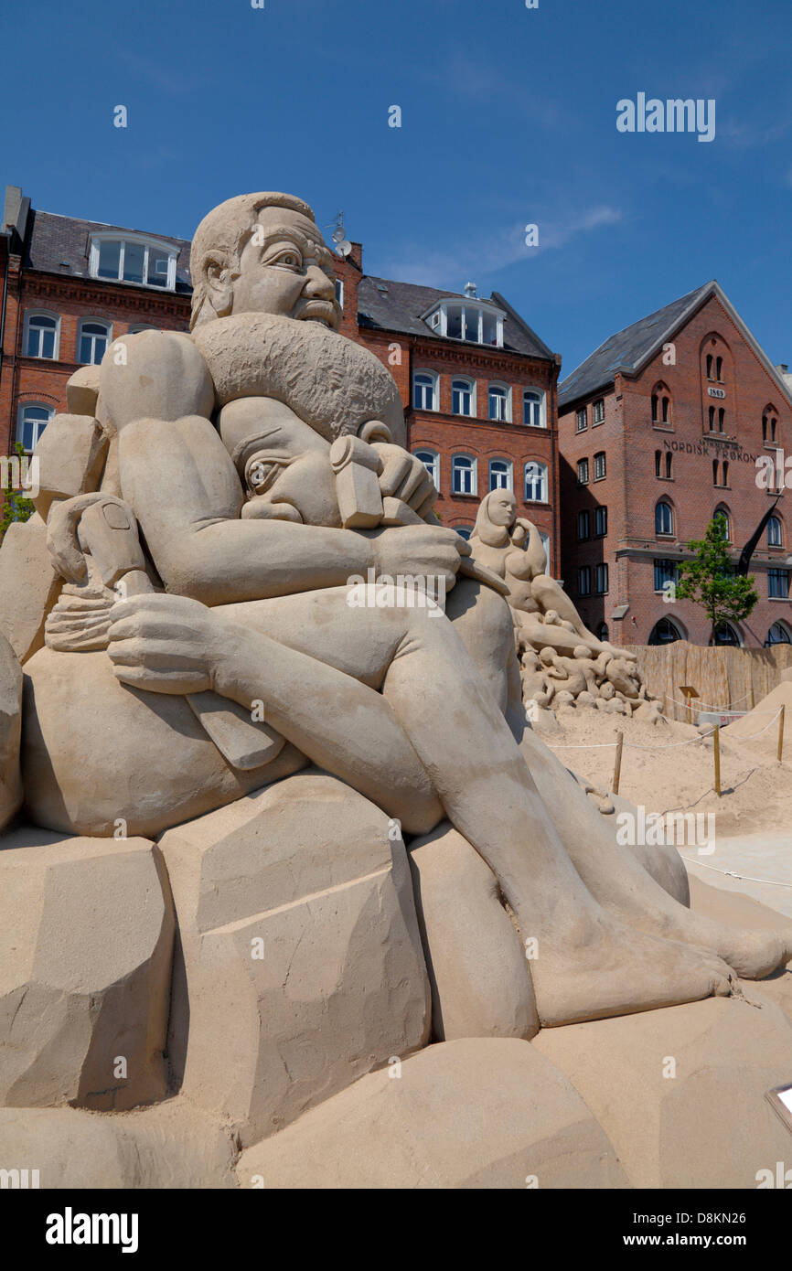 Copenhagen, Denmark. May 30th 2013. 17 sand sculptures of up to 10 metres height built from 3,000 tons sand by 30 international sand artists are on display until August 25th at Havnegade in the port of Copenhagen in one of the most spectacular sand sculpture events in northern Europe. 'In the Mind of the Mask' by Bob Atisso, Togo. Every single meeting shapes us one way or another because there is no useless on earth. We are all uncompleted human-beings. Credit:  Niels Quist / Alamy Live News Stock Photo