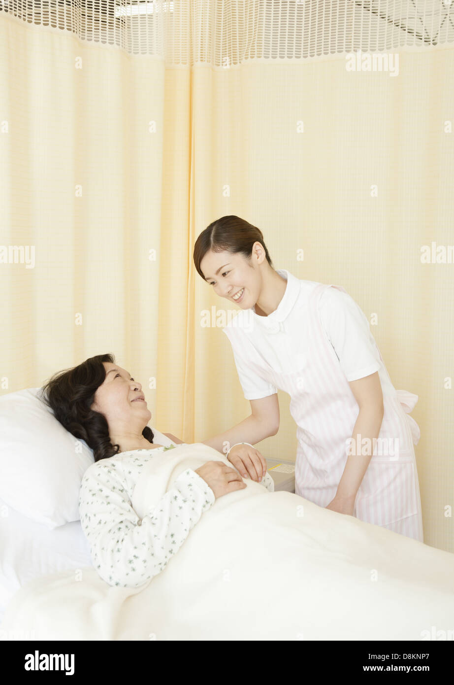 Nurse and patient smiling Stock Photo