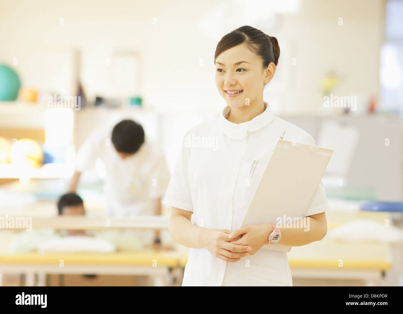 Physical therapist smiling Stock Photo