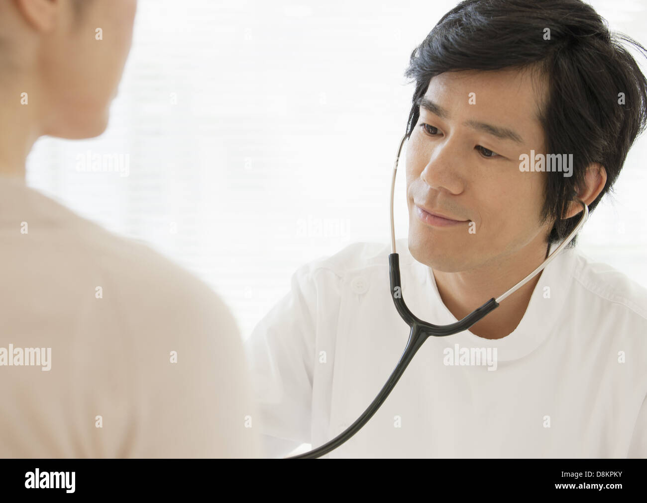 Doctor examining a patient Stock Photo
