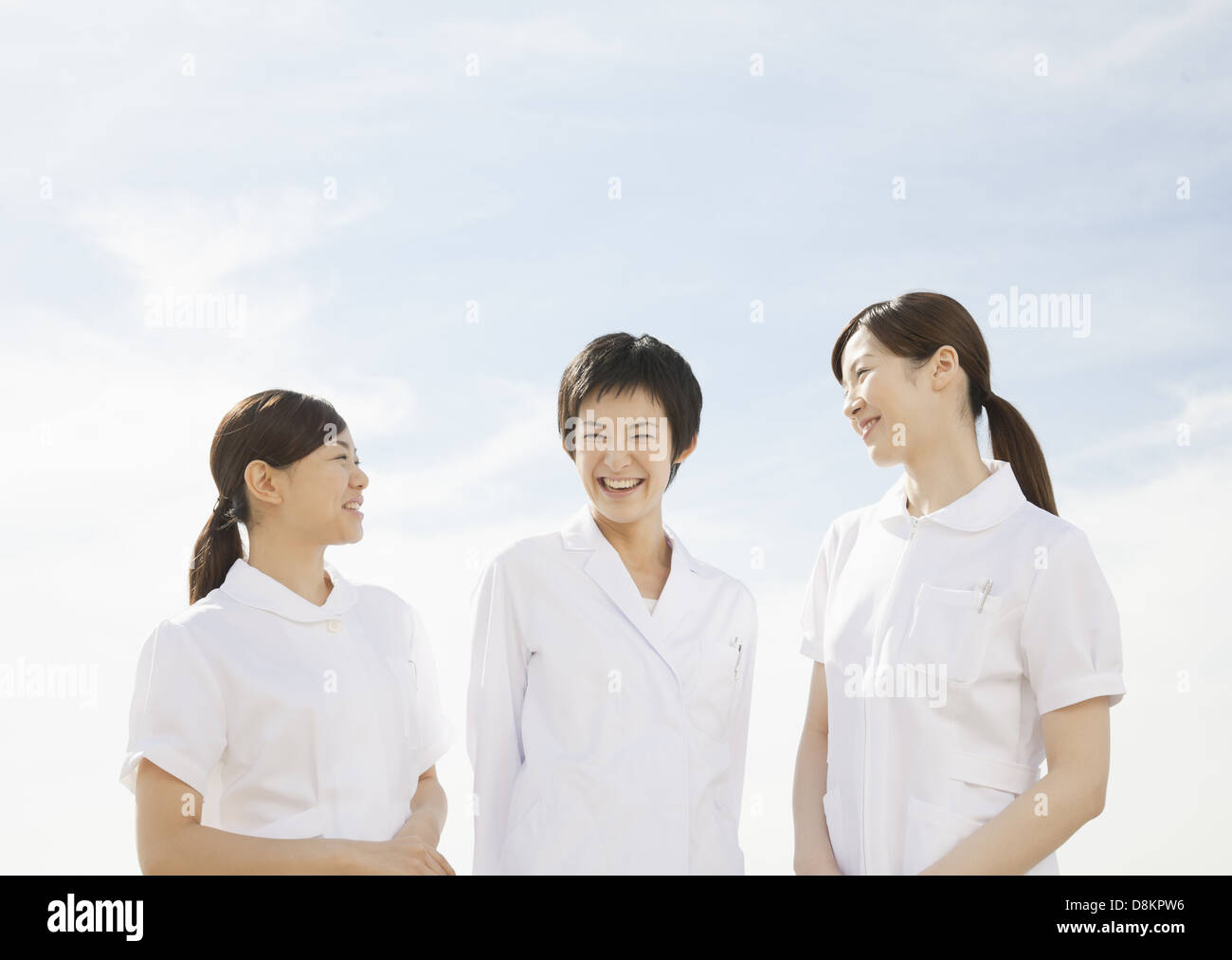 Woman doctor and nurse smiling Stock Photo