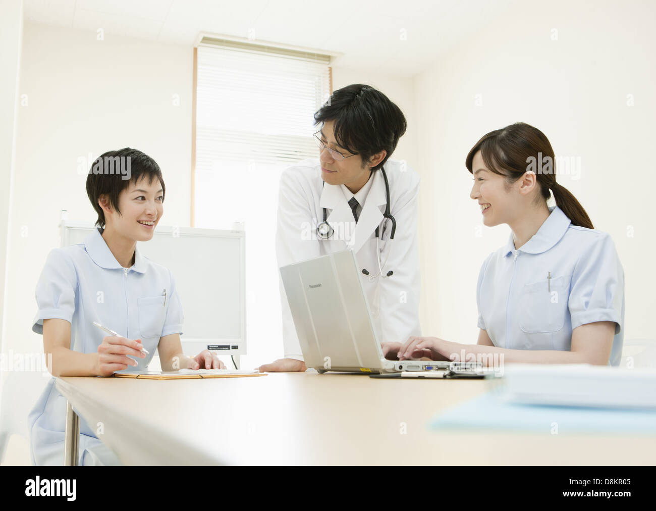 Doctor and nurses having a meeting Stock Photo
