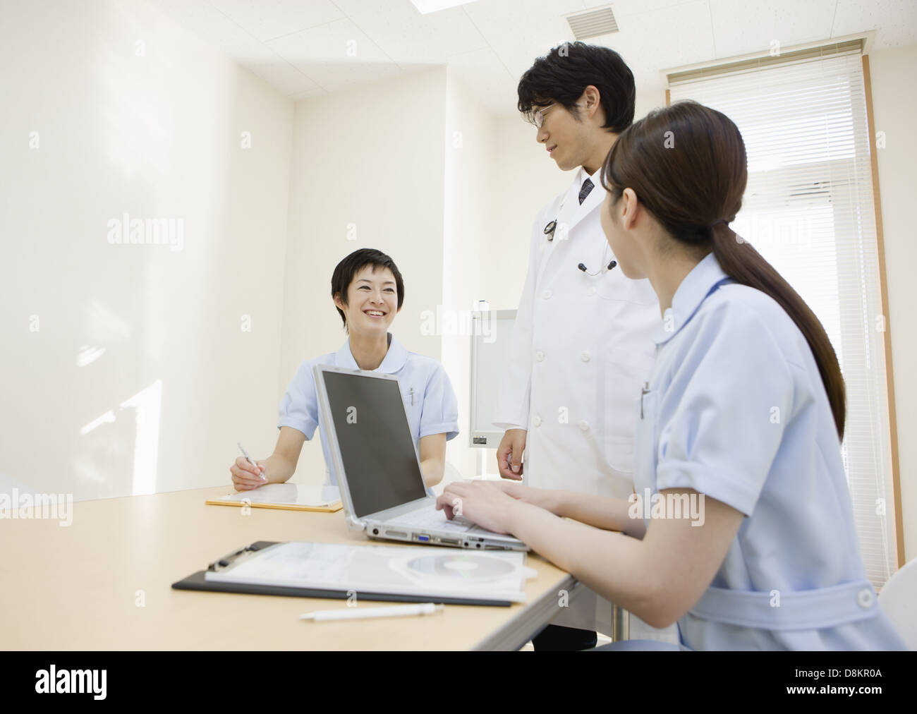 Doctor and nurses having a meeting Stock Photo