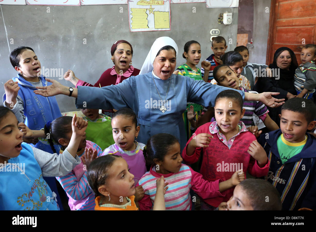 Egypt, christian religious education by a catholic coptic Nun (Sister) in a private household in Upper Egypt Stock Photo