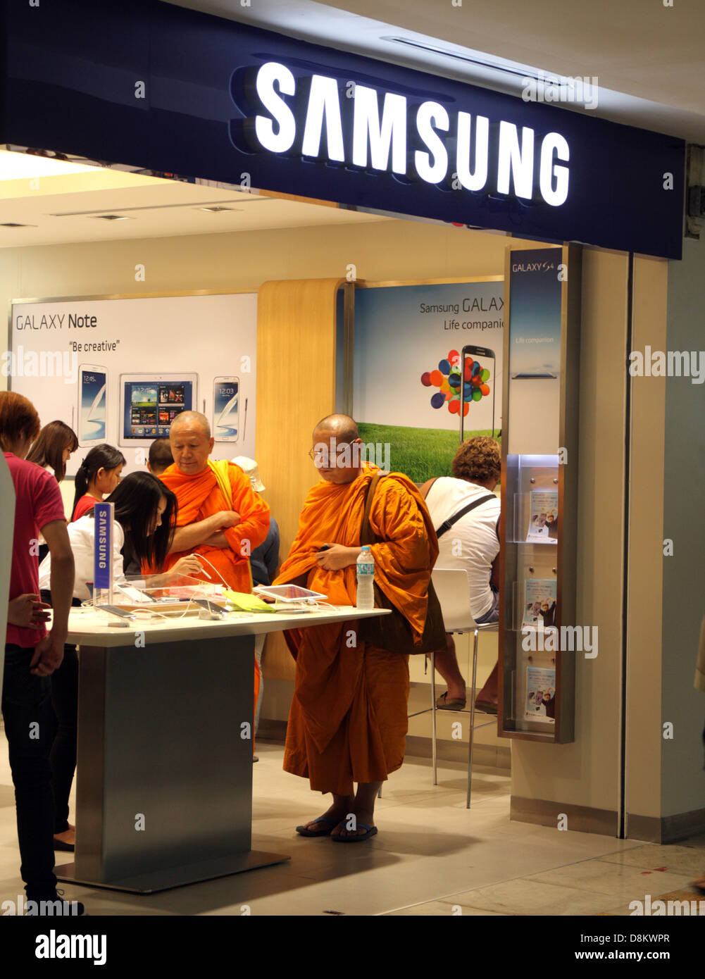 Thai Buddhist monks shopping inside Samsung store in Bangkok , Thailand