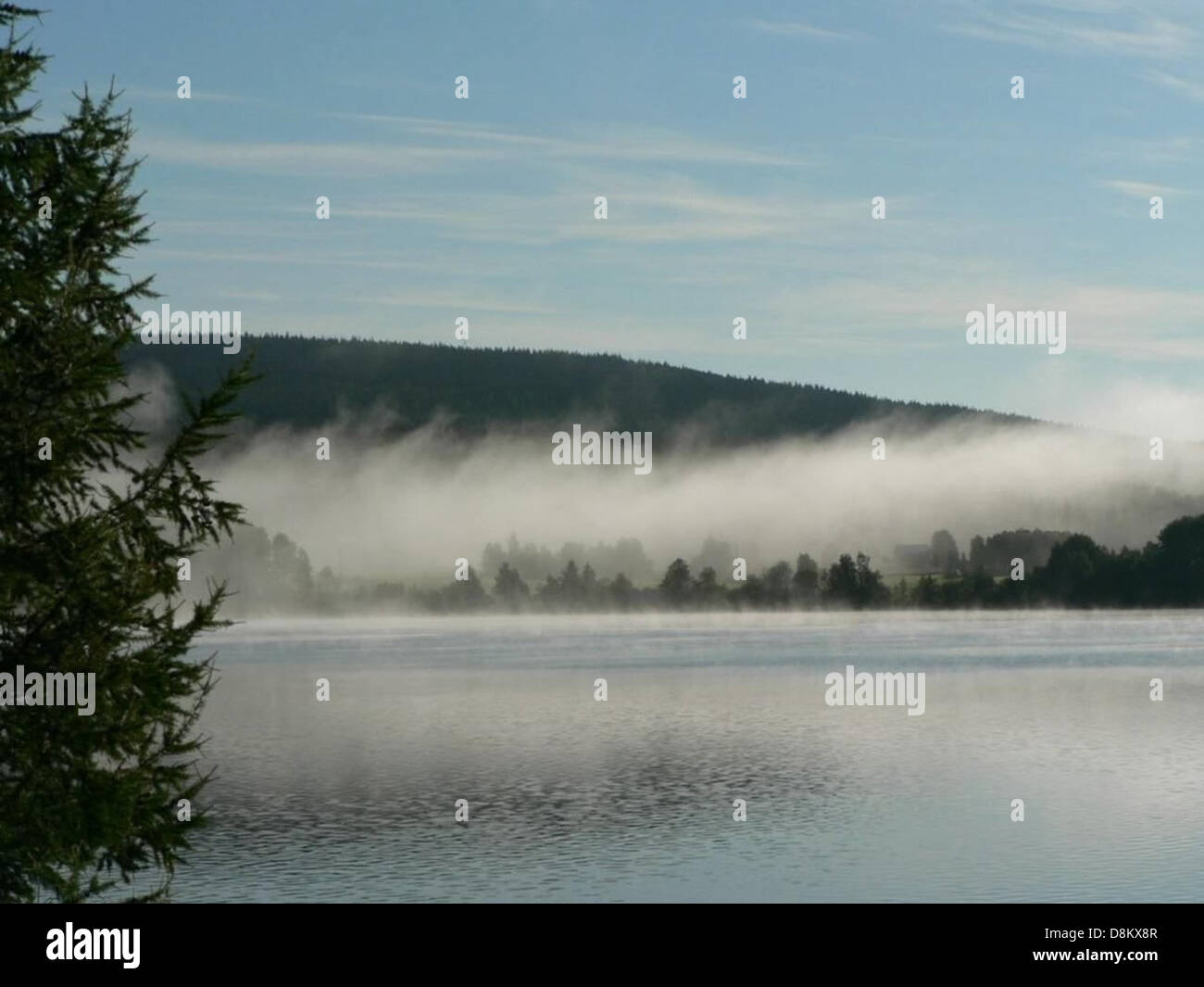 Mist over lake in morning Stock Photo - Alamy
