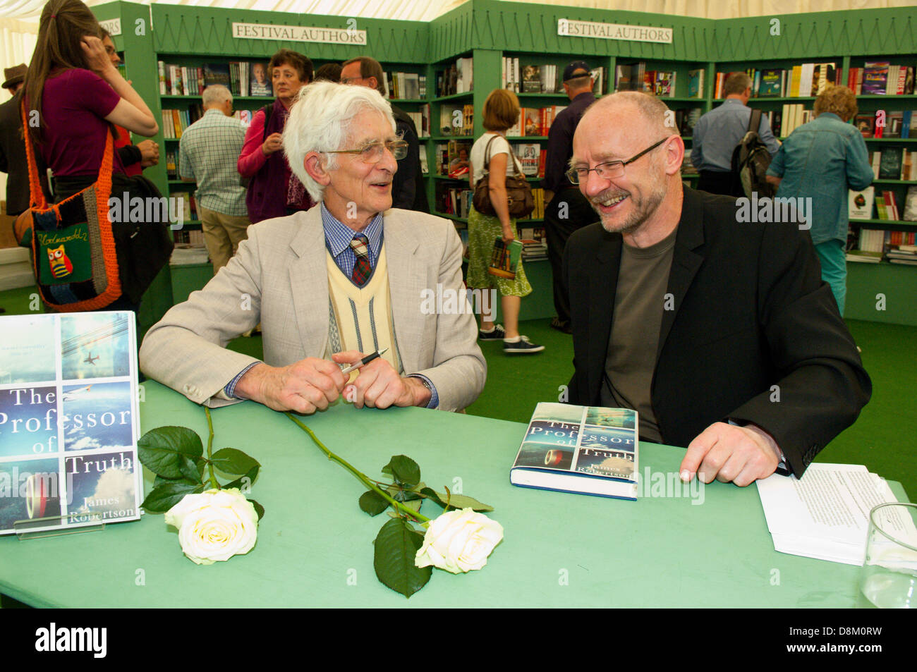 Hay-on-Wye, UK. 31st May 2013. Twenty five years after The Lockerbie Pan Am Flight 103 disaster novelist James Robertson, (R) author of The Professor Of Truth, and a member of the Justice For Megrahi Group – whose daughter was killed on the flight – are seen at the Hay Book Shop at The Hay Festival. Photo Credit: Graham M. Lawrence/Alamy Live News. Stock Photo