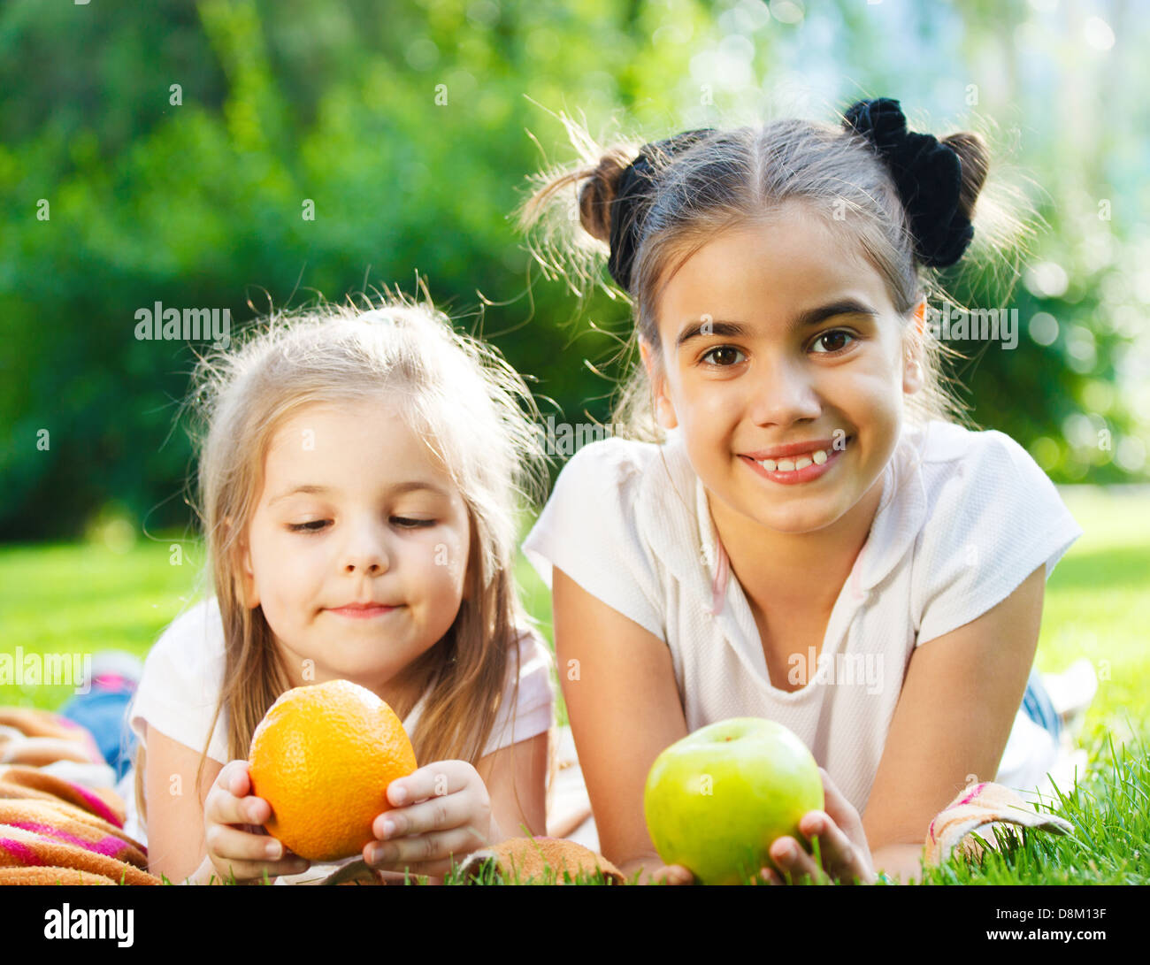 Happy little girls in summer day Stock Photo - Alamy