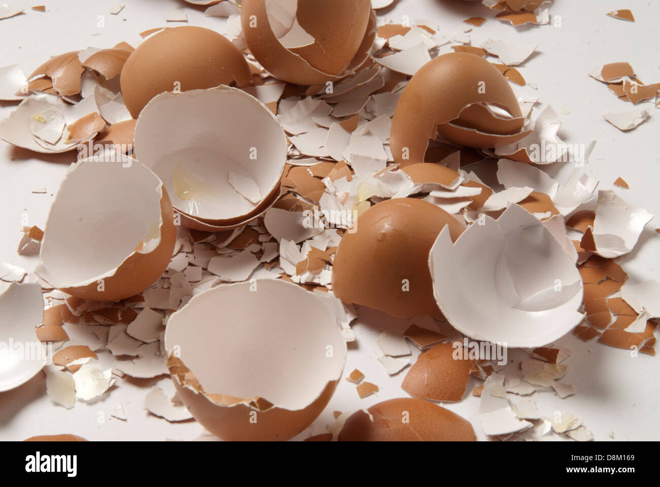 Close-up shot of empty broken brown eggshells Stock Photo