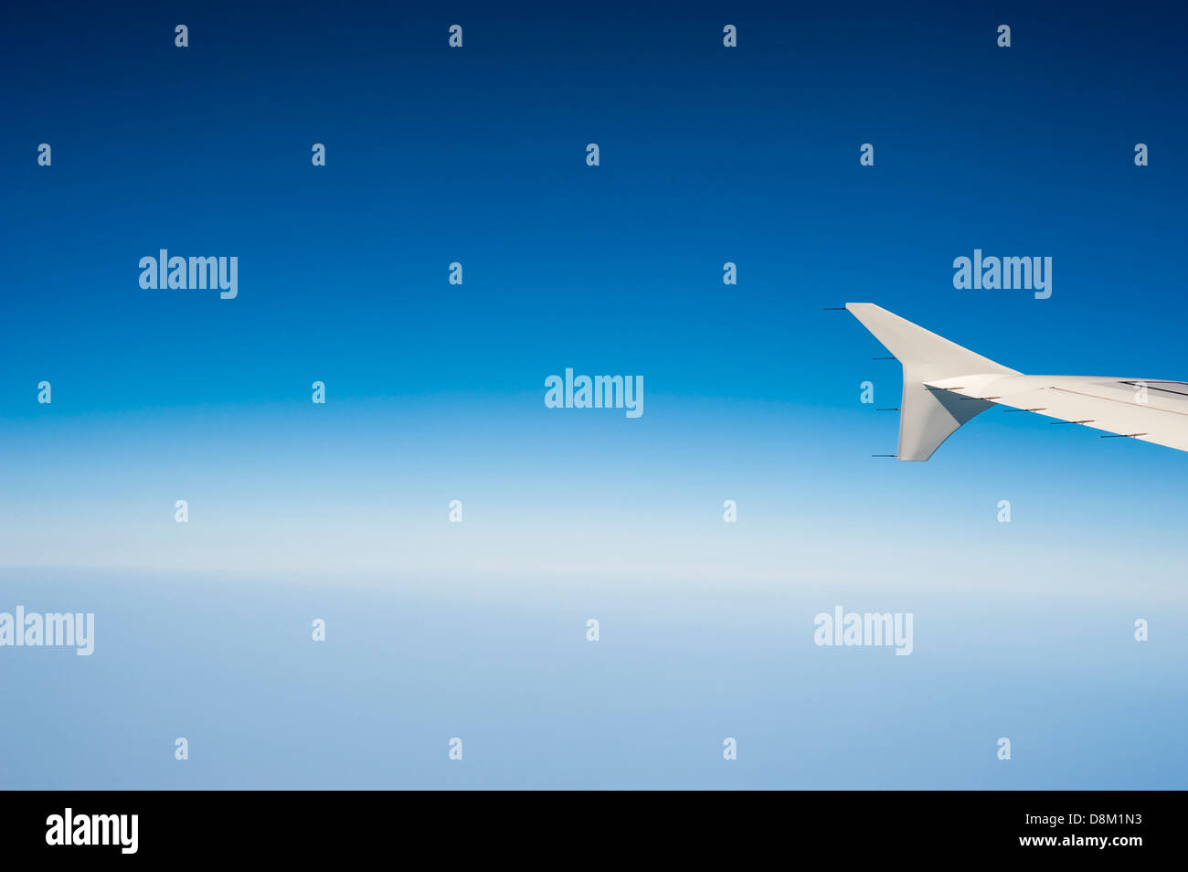 Airplane wing and beautiful blue sky Stock Photo - Alamy