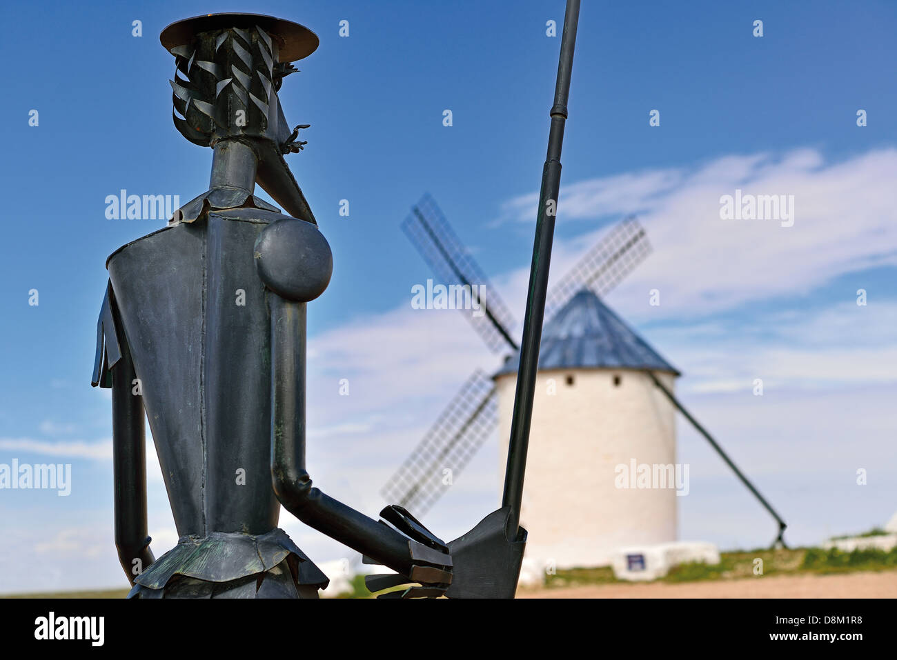 Spain, Castilla-La Mancha: Windmill  and statue of Don Quijote in Campo de Criptana Stock Photo