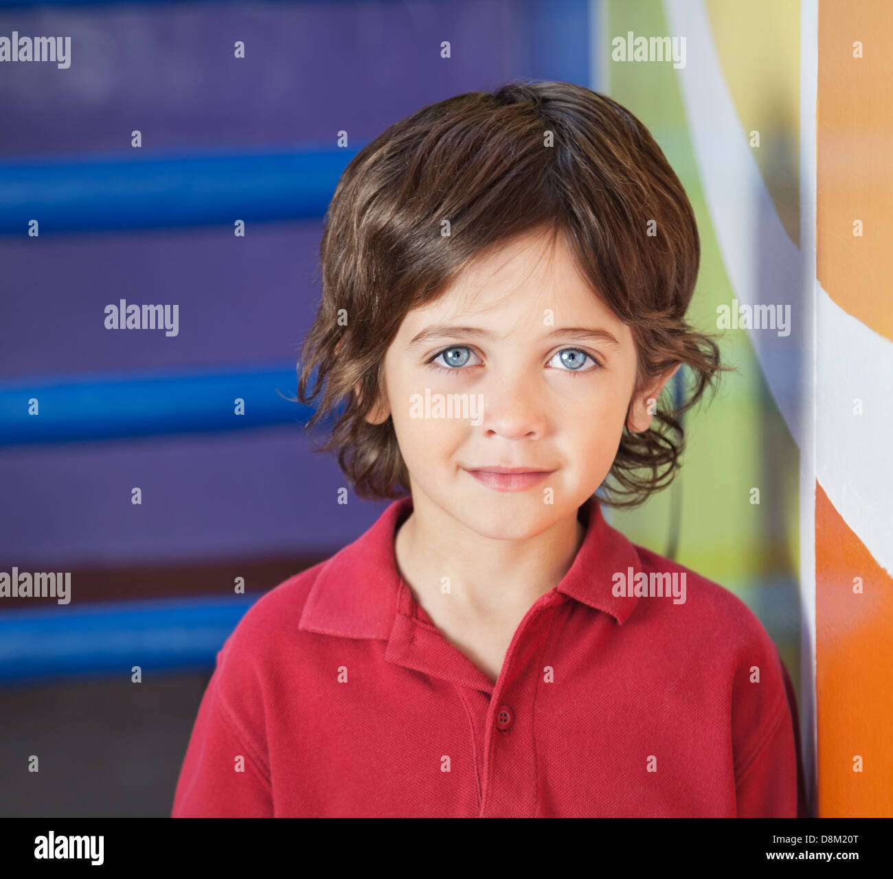 Boy In Casuals Smiling In Preschool Stock Photo