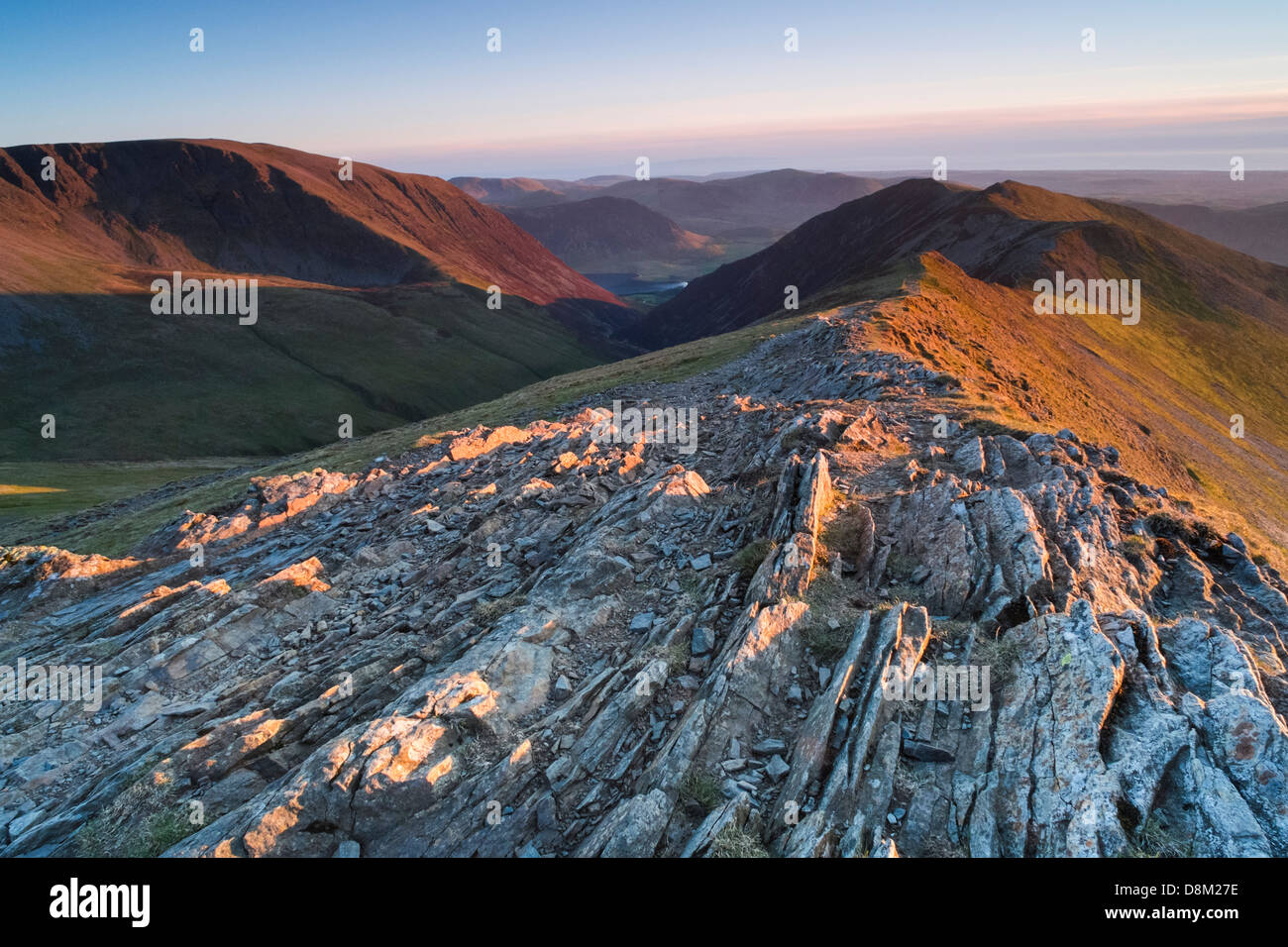 Looking towards Whiteside from the summit of Hopegill Head at sunset in the Lake District Stock Photo
