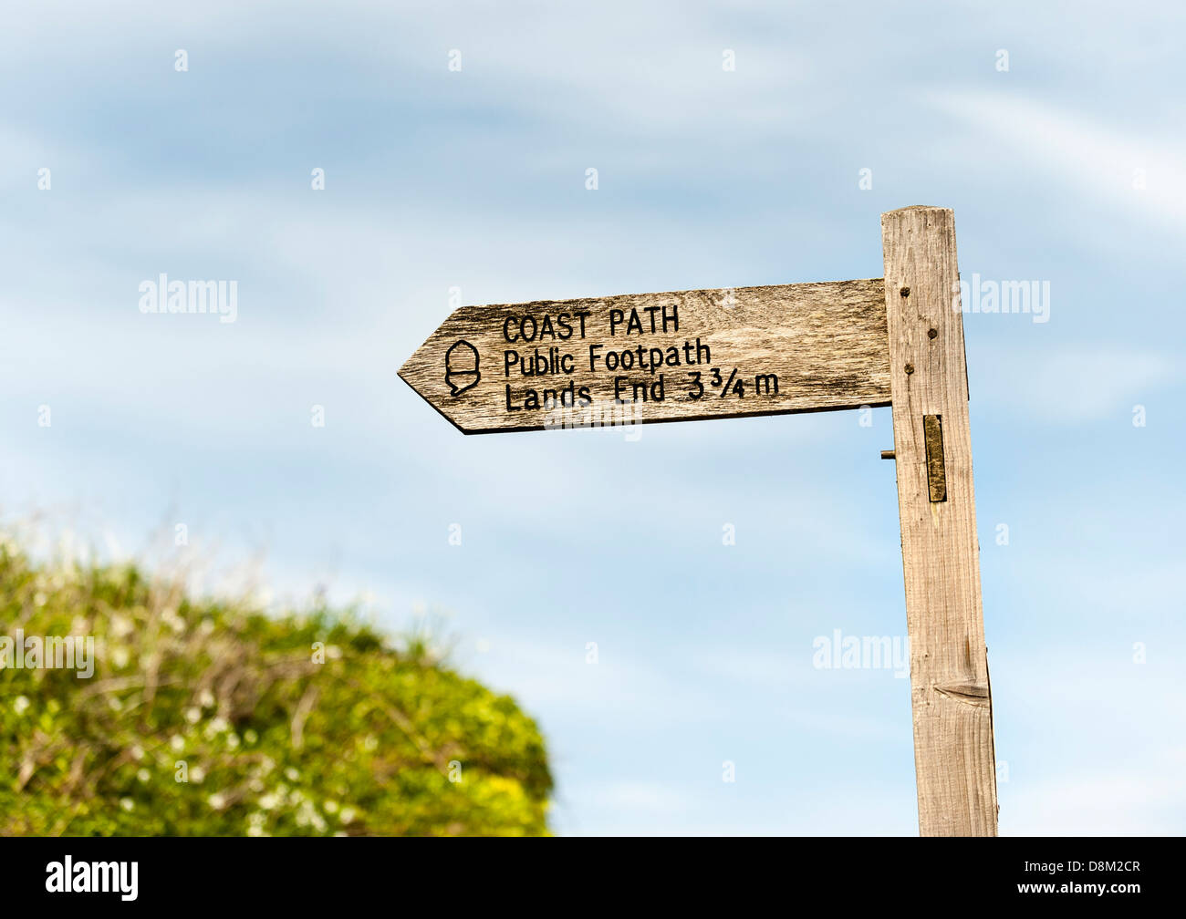 A sign giving directions to the coast path to Lands End in Cornwall. Stock Photo