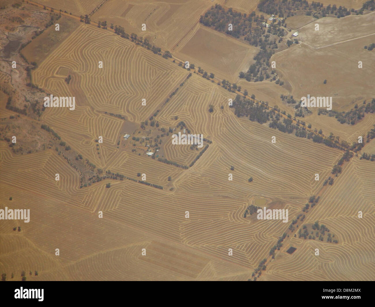 Aerial view of harvester machines working in fields near Northam and ...
