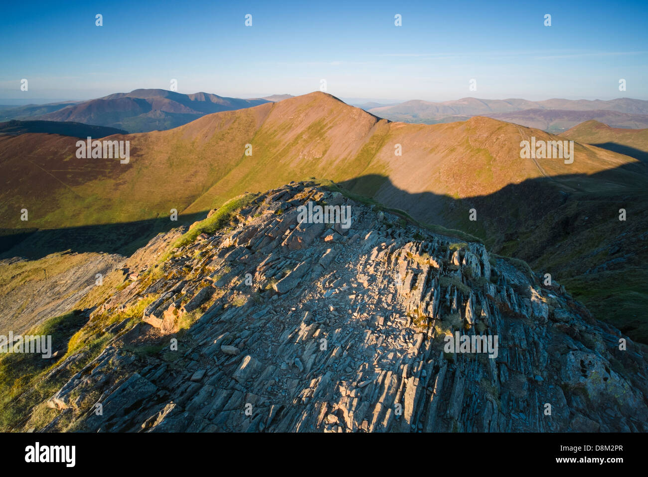 Looking towards Grisedale Pike  from the summit of Hopegill Head at sunset in the Lake District Stock Photo