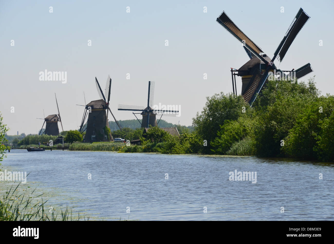 windmills holland canals channels water waterways Stock Photo