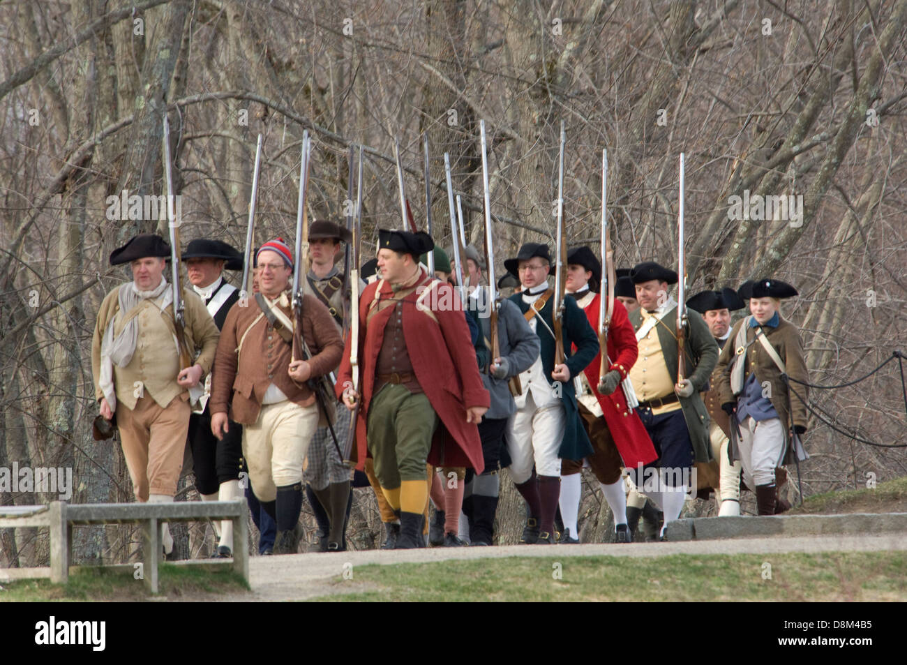 Minutemen reenactors marching to battle the British at the Battle of Concord, Minuteman National Historical Park, Concord MA. Digital photograph Stock Photo