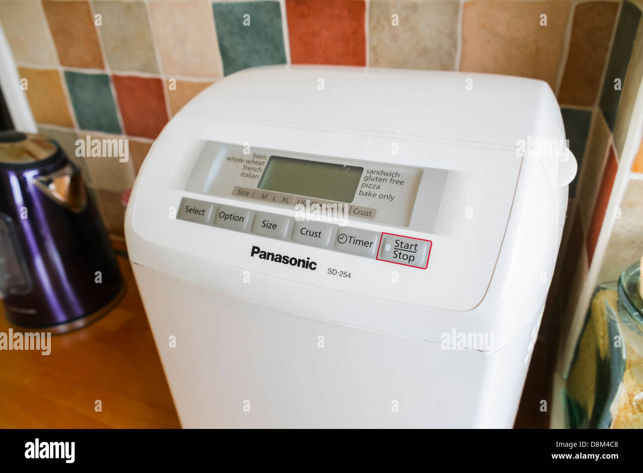 A Panasonic bread making machine on a kitchen worktop Stock Photo