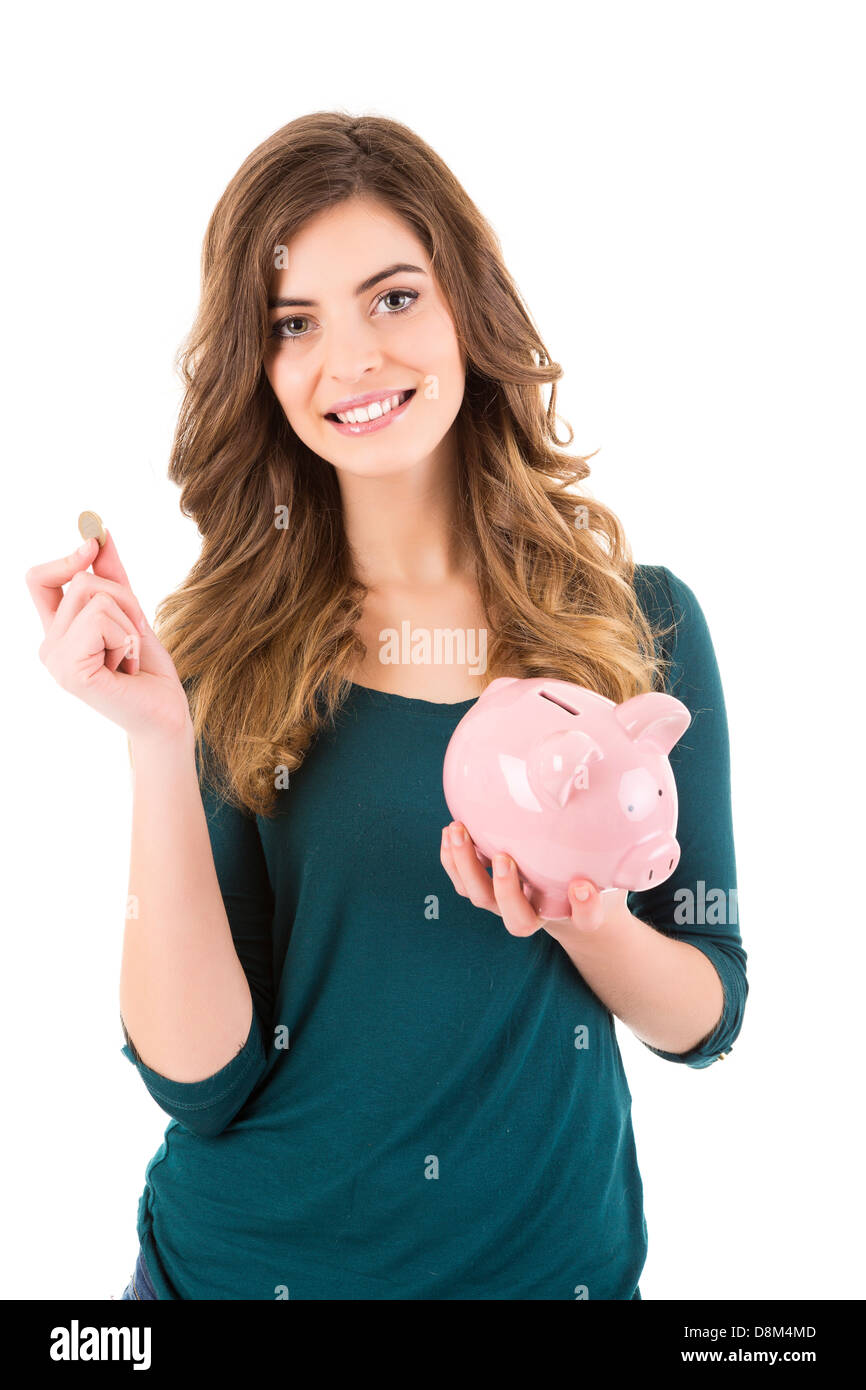 Casual woman looking to save money in a piggy bank Stock Photo - Alamy