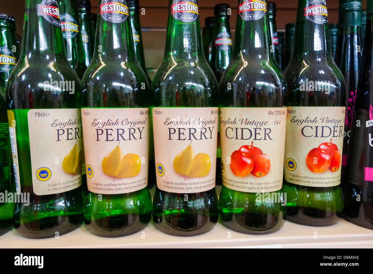 Bottles of English Perry and vintage Cider on a supermarket shelf Stock