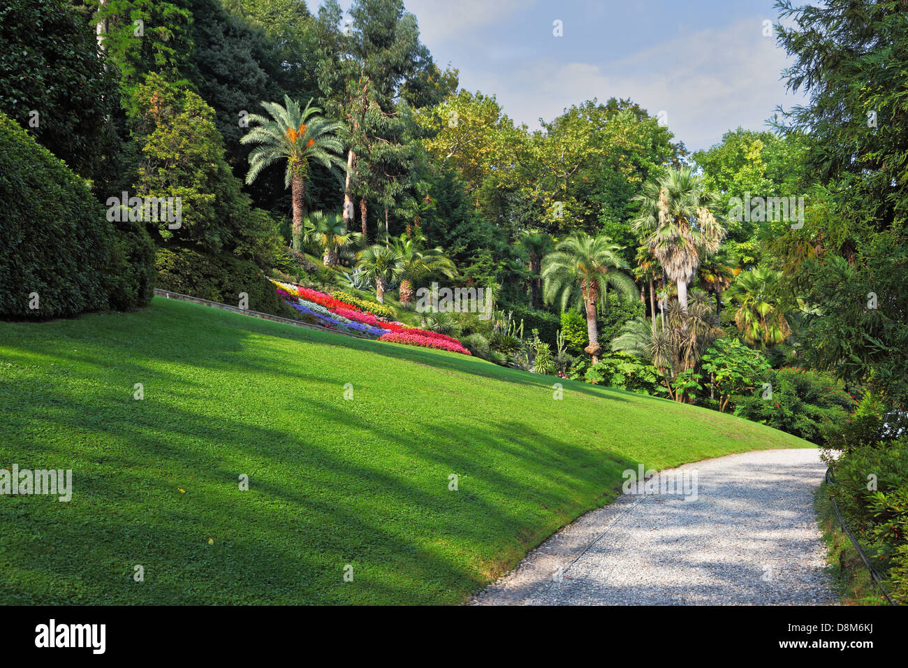 The flowerbeds, lawn and path Stock Photo