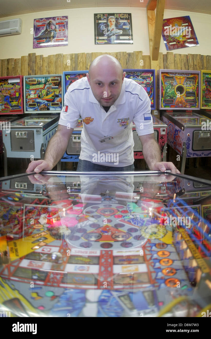 Echzell, Germany. 31st May 2013. Reigning pinball champion Daniele Celestino  Acciari stands at Freddy's Pinball Paradise in Echzell, Germany 31 May  2013. It is the first time that the championship is taking