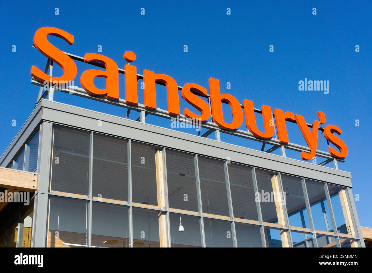 A large sign over a Sainsbury's supermarket. Stock Photo