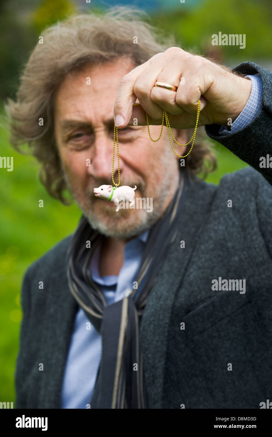 Howard Jacobson with novelty pig that his wife bought him as a present for winning the 2013 Bollinger Everyman Wodehouse Prize for Comic Fiction for his novel 'Zoo Time' pictured at Hay Festival 2013 Hay on Wye Powys Wales UK Stock Photo