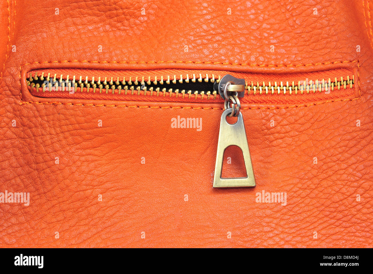 orange leather with zipper Stock Photo