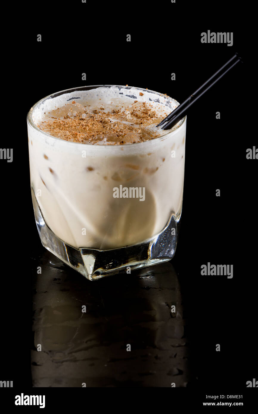 classic cocktail brandy alexander served on the rocks isolated on black