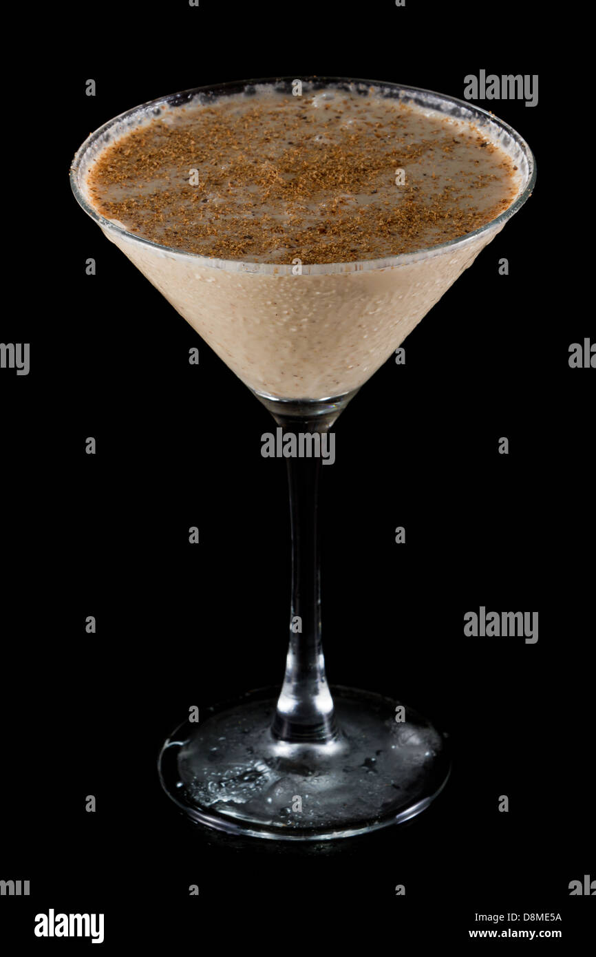 classic drink brandy alexander with fresh nutmeg on top served in a