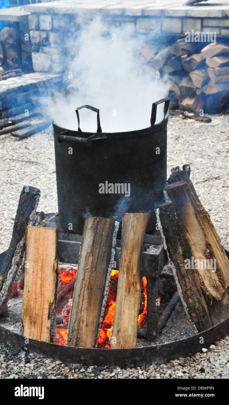 Steam issues from a large pot during a traditional Wisconsin fish boil at the White Gull Inn in Fish Creek Stock Photo