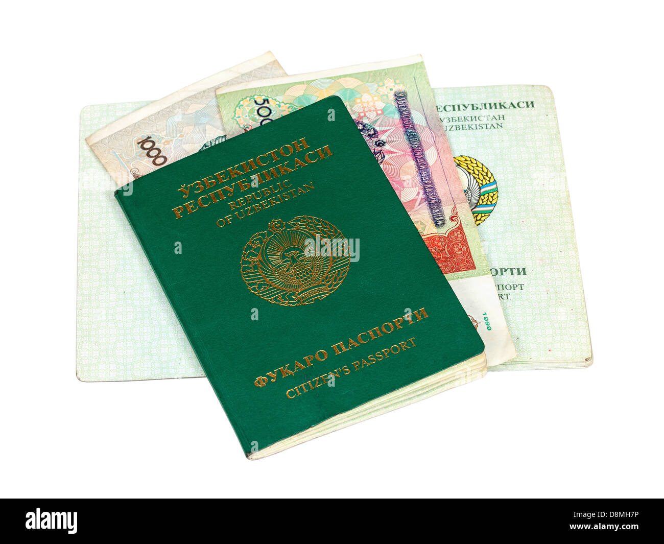 Uzbekistan passport and money isolated on white background Stock Photo