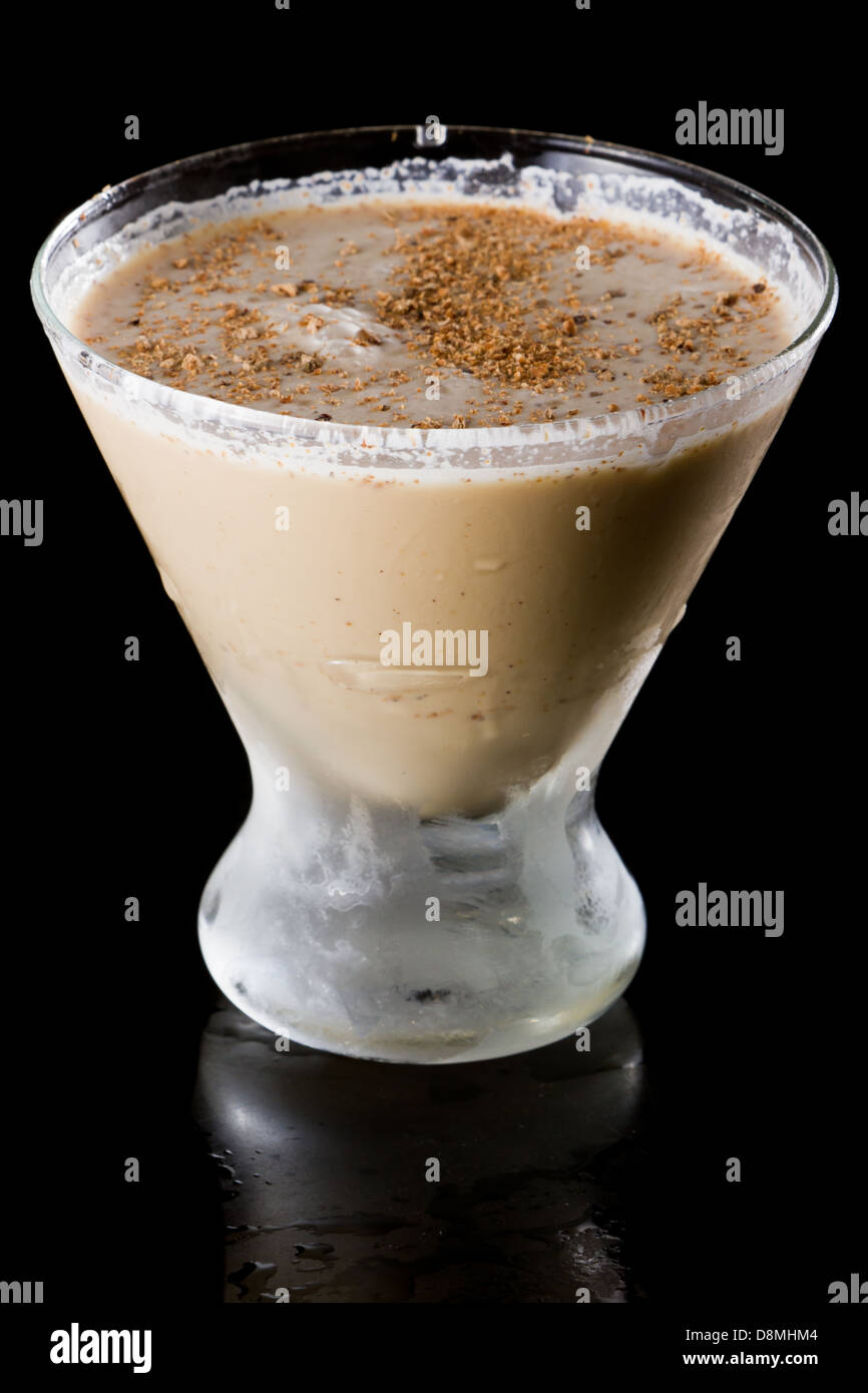 classic drink brandy alexander with fresh nutmeg on top served in a