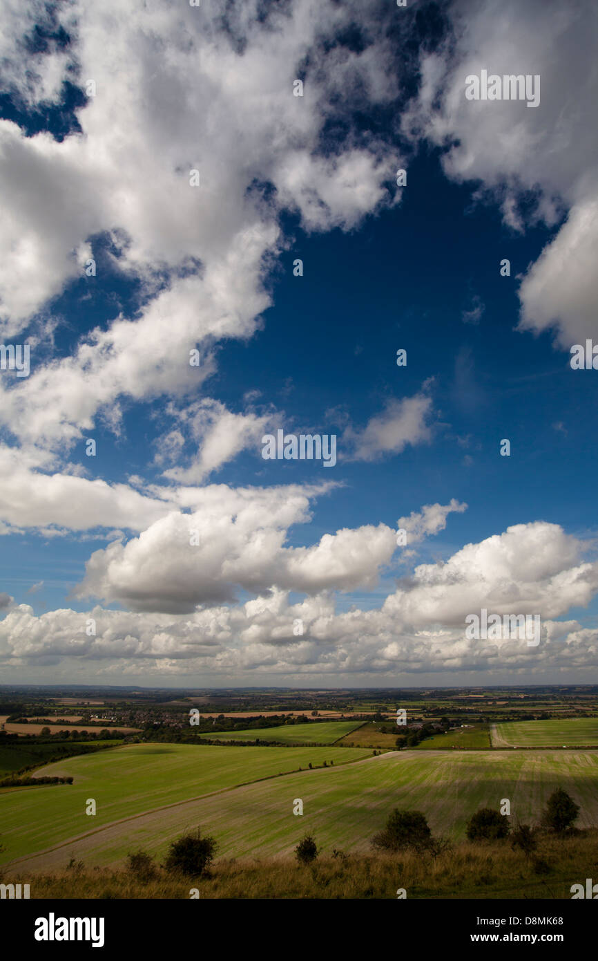 Rolling green hills with blue skies and clouds Stock Photo - Alamy