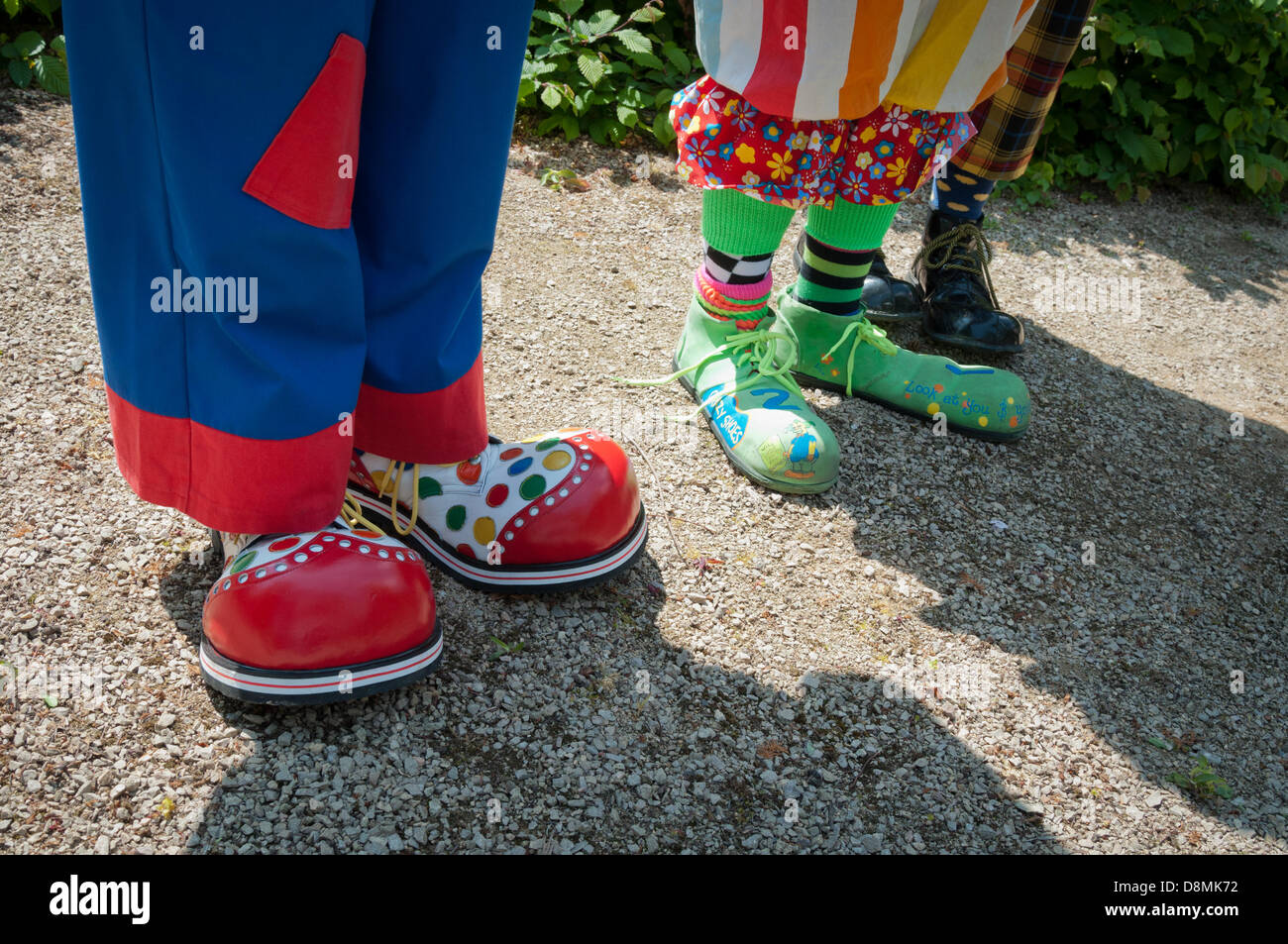 London, England UK. 31st May 2013. Clowns gather at Joseph Grimaldi Park to honour the memory of Joe Grimaldi. The park is a former burial ground and the final resting place of the original Clerkenwell Clown. Each year clowns celebrate Grimaldi's life by gathering at his grave in full costume, cracking jokes and performing tricks in memory of the great clown. Credit:  Patricia Phillips/Alamy Live News Stock Photo