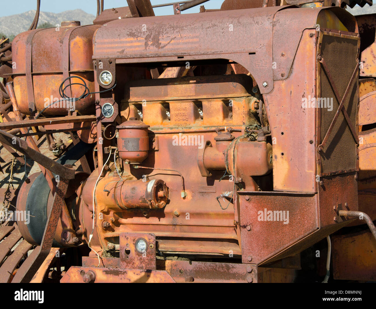 Close up of an old, rusty gasoline engine used to power farm equipment Stock Photo