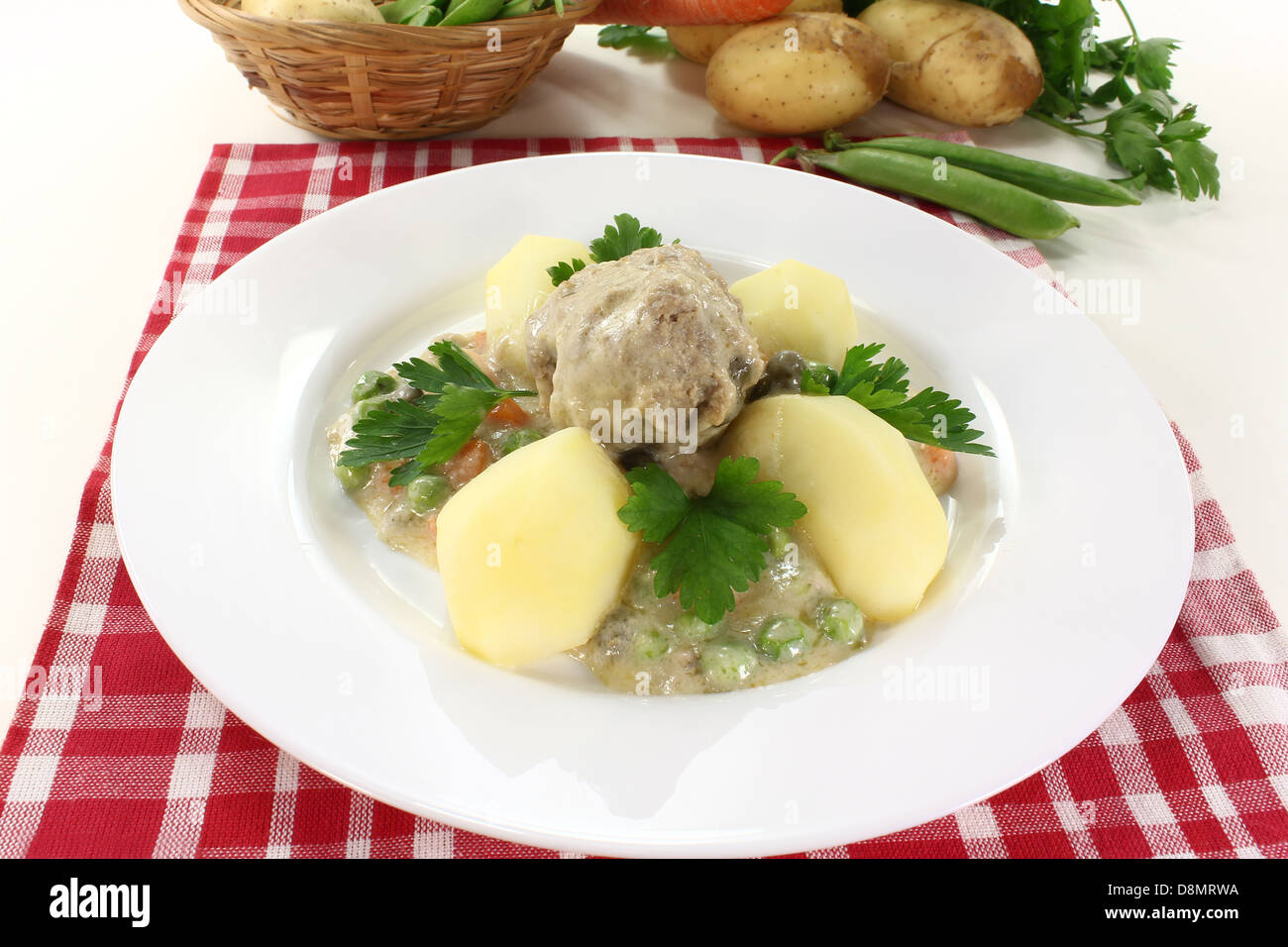 cooked meatballs in a white sauce Stock Photo