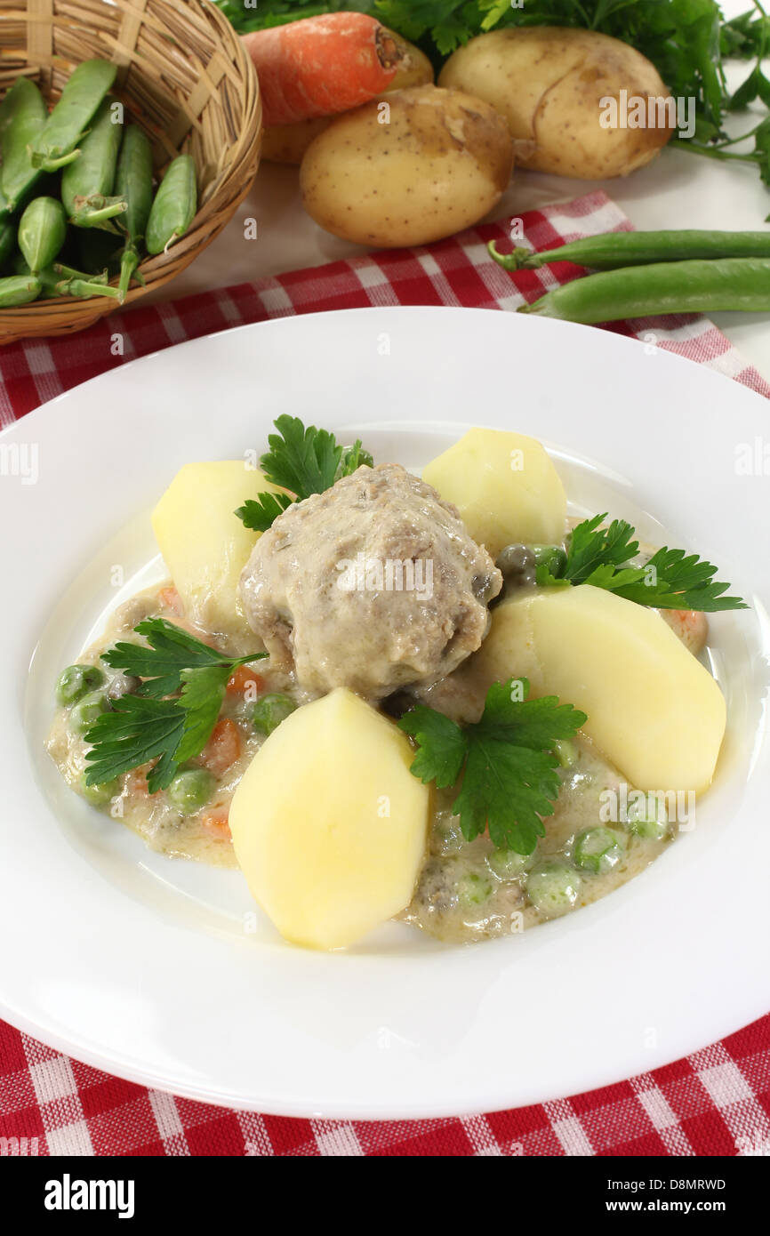 cooked meatballs in a white sauce Stock Photo