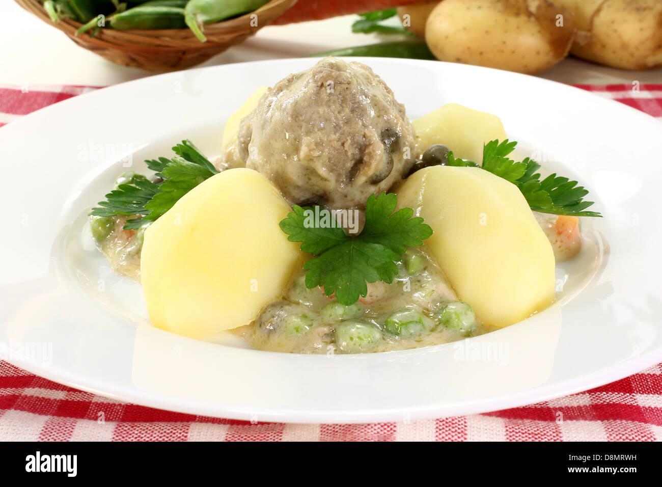 cooked meatballs in a white sauce Stock Photo