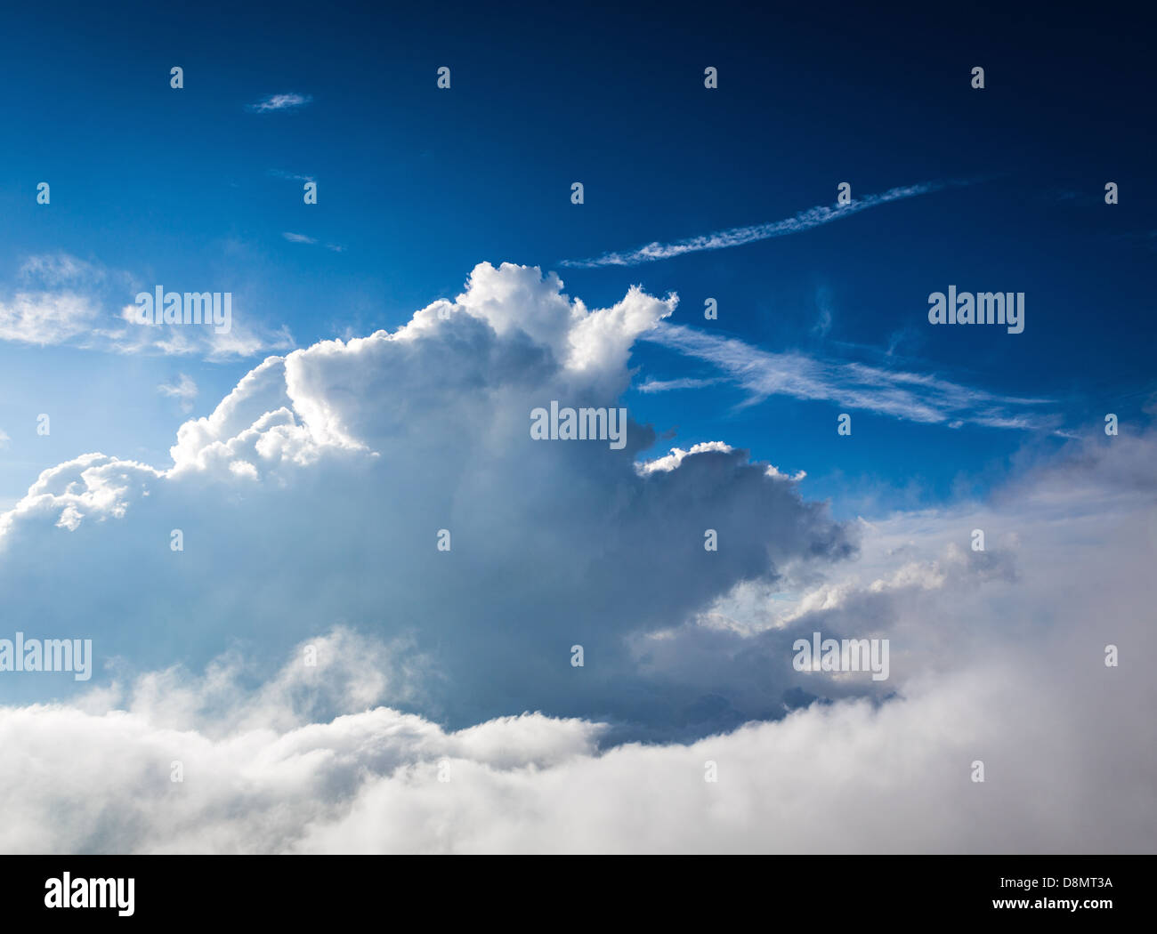 Large, fluffy white clouds on a blue sky day Stock Photo