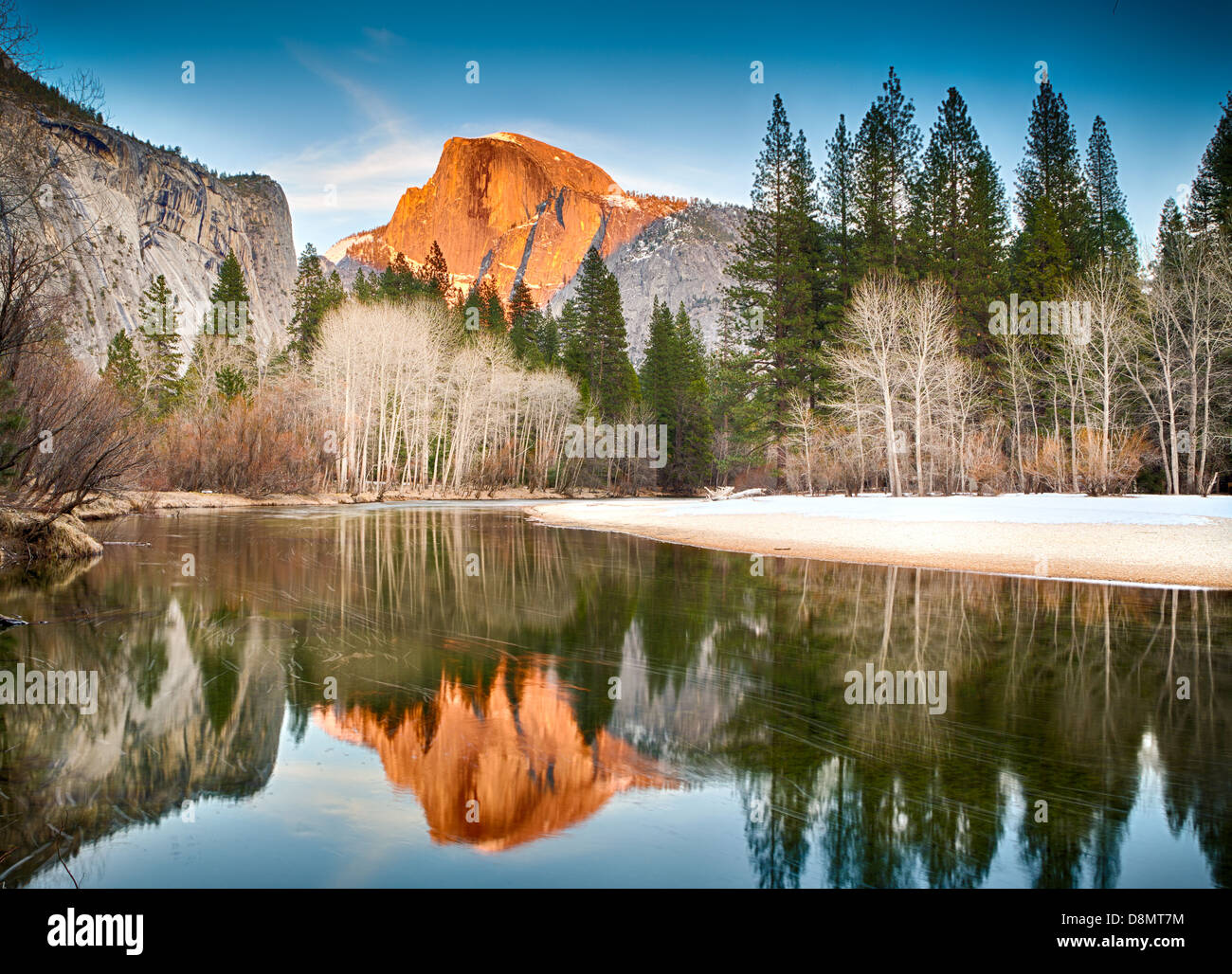 View of half dome at sunset reflected in the Merced River Stock Photo